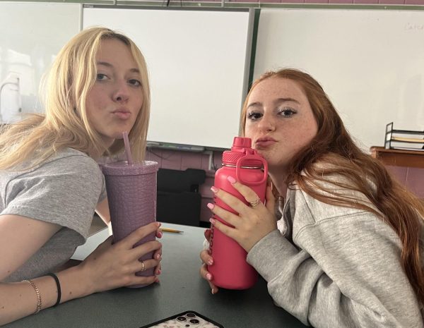 Juniors Abigail Toomey (left) and Leah LaFever enjoy a LHS sanctioned beverage in English class. 
