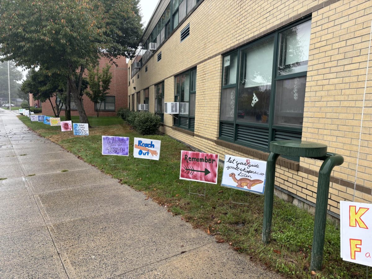 Signs promoting suicide awareness line the outside of LHS this week.