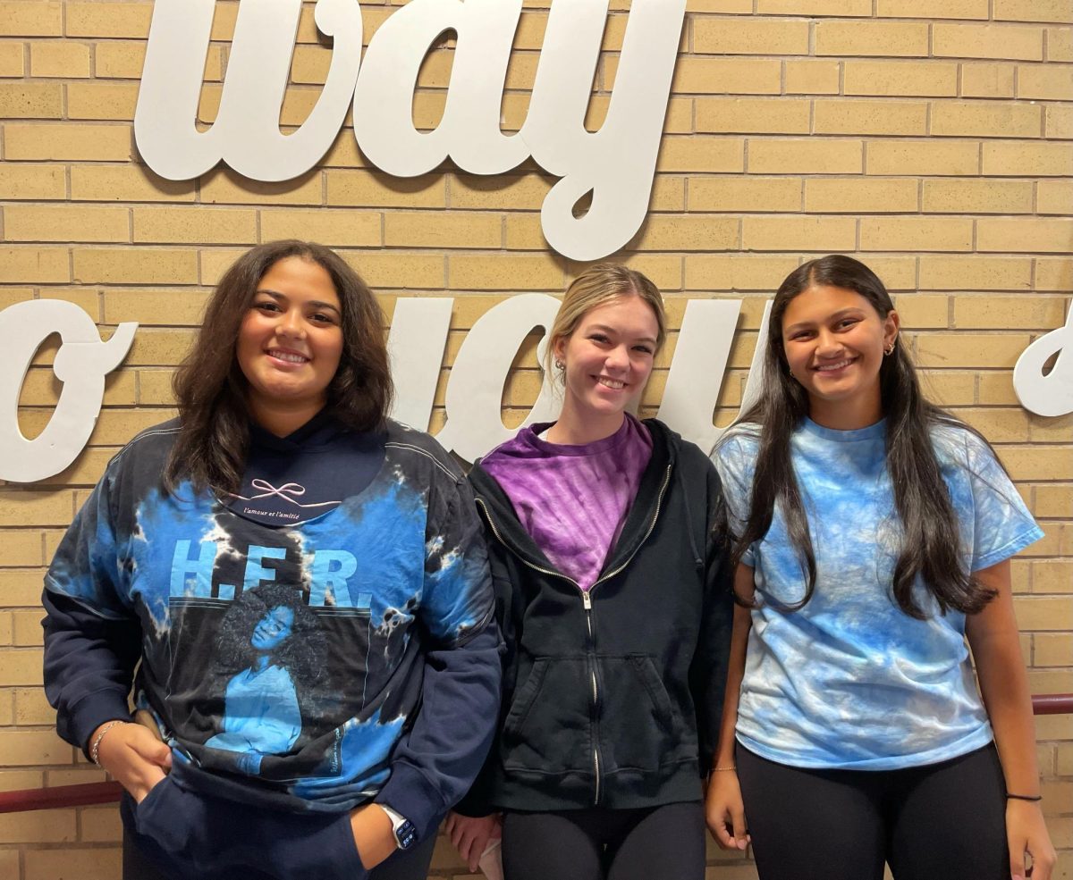 Left to right: juniors Allison Lewis, Madison Mathias, and Bella San Jurjo stun in their tye dye shirts.