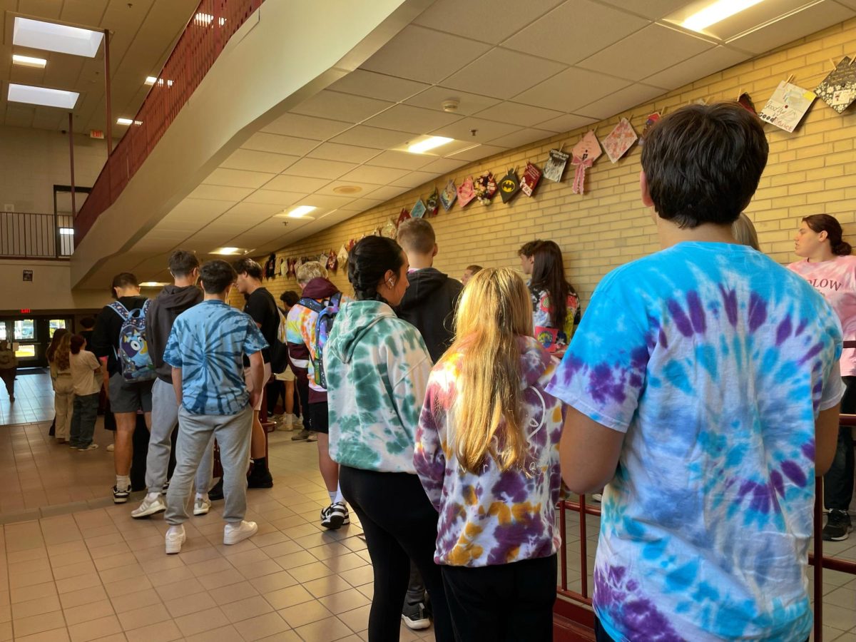 The senior class gather in tye dye, securing a win. 