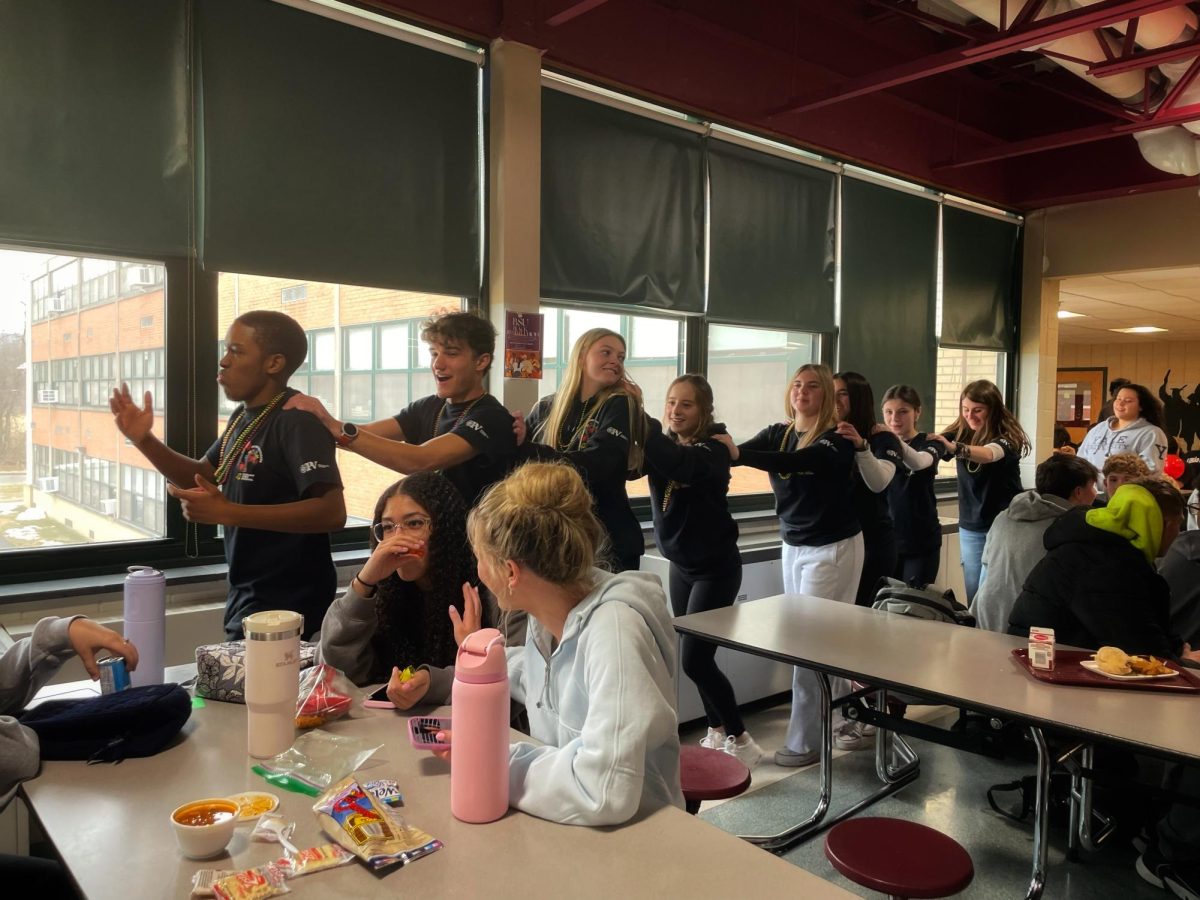 The conga line passes my lunch table.